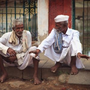 elderly men talking on the street