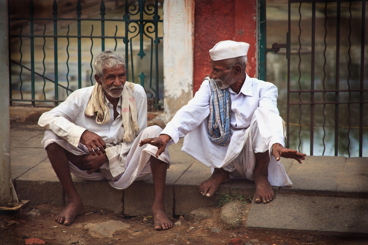 elderly men talking on the street